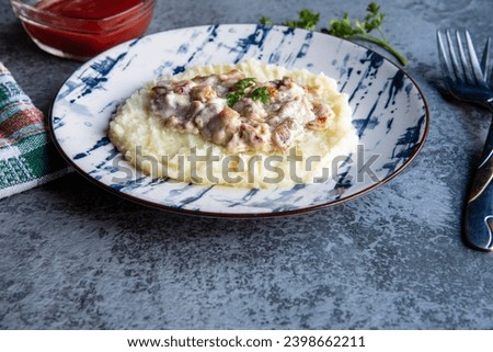 Mashed potatoes with chicken sauce... Royalty-Free Stock Photo #2398662211