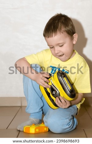 little boy with   the toy car