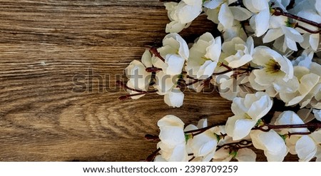 Feminine wedding table composition with white peonies flowers on old shabby wooden background. Empty copy space. Flat lay, top view. Picture for blog. Floral corner. Styled stock photo.