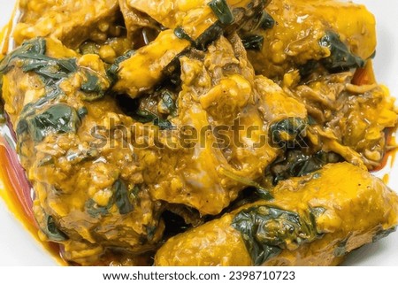 Sese Plantains( Porridge ) - a popular Cameroonian and West African everyday meal that is brimming with flavors from plantains, meat and spices and seasonings Royalty-Free Stock Photo #2398710723