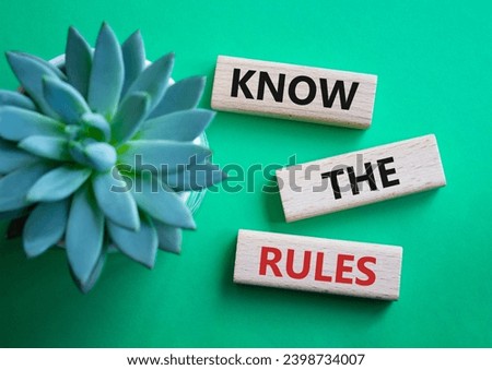 Know the rules symbol. Wooden blocks with words Know the rules. Businessman hand. Beautiful green background with succulent plant. Business and Know the rules concept. Copy space.
