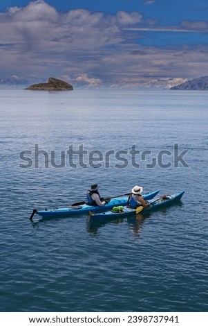 Sea kayaking on Lake Titicaca can be a unique and memorable experience, allowing you to explore its stunning landscapes, traditional communities, and ancient cultures Royalty-Free Stock Photo #2398737941