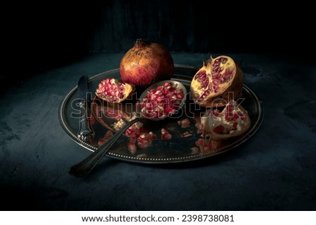  Chiaroscuro still life of pomegranates
 Royalty-Free Stock Photo #2398738081