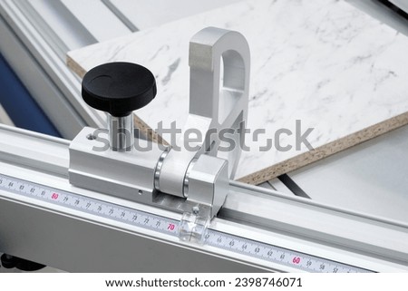 Measuring and marking tool rulers for marking sawing wood panels at a furniture factory