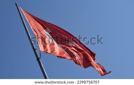 The turkish flag with sky look very bright.