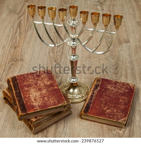 menorah and old books Royalty-Free Stock Photo #239876527