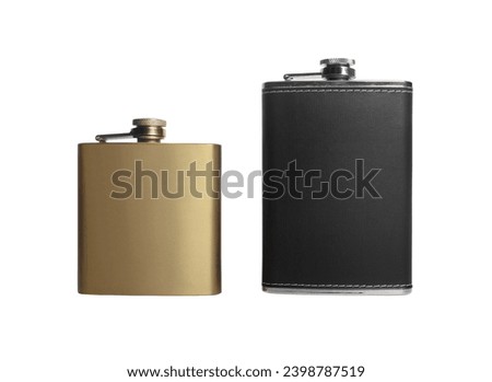 Two stainless hip flasks isolated. Royalty-Free Stock Photo #2398787519