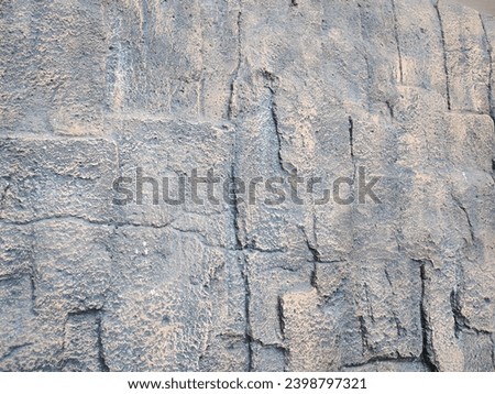 Cement concrete wall background. Gray stone texture and untreated wall surface after finishing.