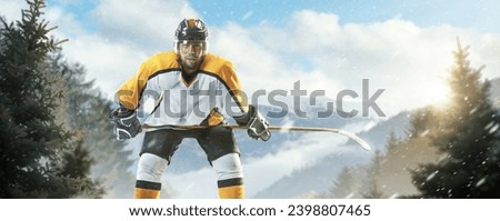 Professional hockey player. Sports emotions. Isolated on ice. Hockey player on an outdoor skating rink in the forest. Athlete in action