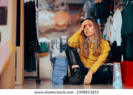 
Tired Woman Feeling Overwhelmed During Shopping Spree. Unhappy exhausted customer resting on a store floor
 Royalty-Free Stock Photo #2398813853