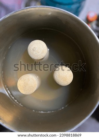 A cup of liquid with a few objects in it
Ceramic filter 
Steel filter Royalty-Free Stock Photo #2398818869