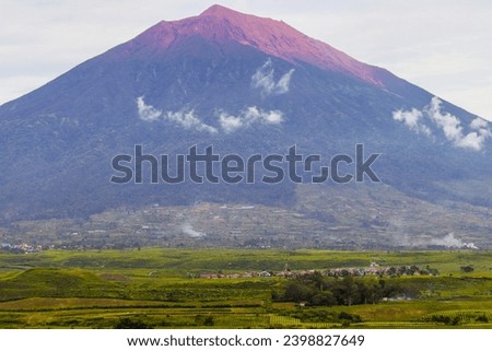 Mount Kerinci (Gunung Kerinci) is the highest mountain in Sumatra, the highest volcano and the highest peak in Indonesia with an altitude of 3805 masl, located in the Kerinci Seblat National Park area Royalty-Free Stock Photo #2398827649