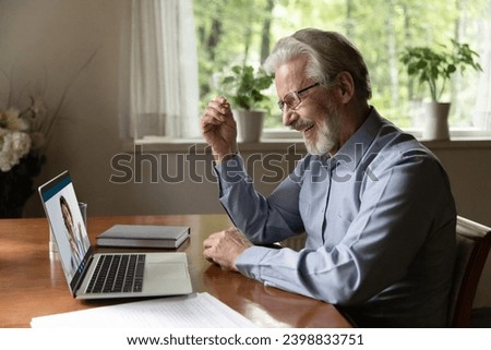 Telemedicine. Energetic smiling elderly man grandfather having virtual consultation online with young female doctor gp. Woman medic check health status of senior man patient by videocall using laptop Royalty-Free Stock Photo #2398833751