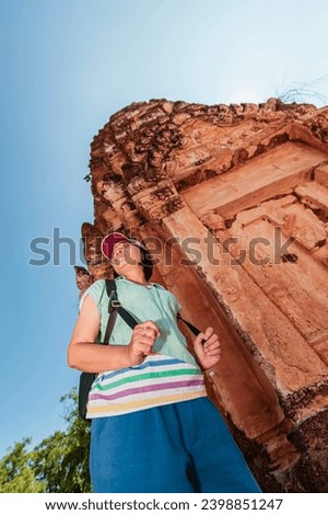 Asian tourist woman and ancient historical site in Sukhothai Province, Thailand