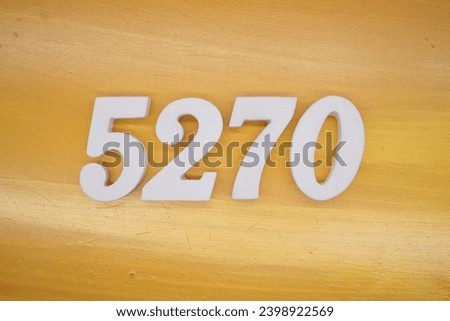 The golden yellow painted wood panel for the background, number 5270, is made from white painted wood.