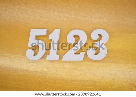 The golden yellow painted wood panel for the background, number 5123, is made from white painted wood.