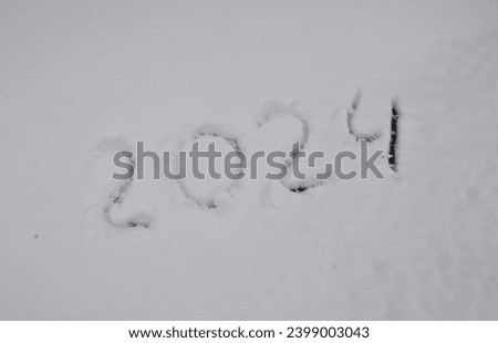 inscription 2024 on the snow. new year 2024.