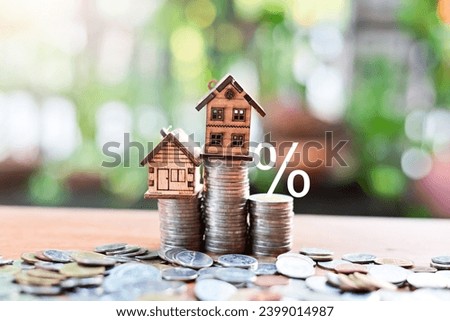 house model and money coins saving for concept investment mortgage finance and home loan refinance Royalty-Free Stock Photo #2399014987