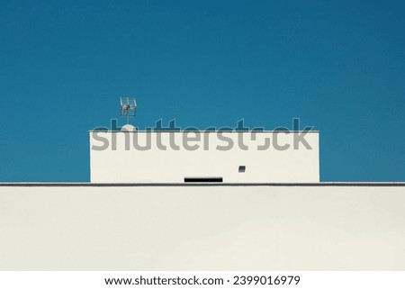 Modern architecure. Attic at the top of a building Royalty-Free Stock Photo #2399016979