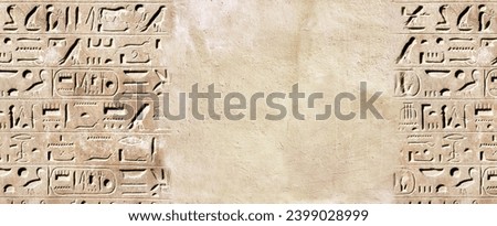 Horizontal background with ancient Egyptian hieroglyphs on stone wall, Egypt, Africa. Backdrop with sandstone carving with hieroglyph. Mock up template. Copy space for text Royalty-Free Stock Photo #2399028999