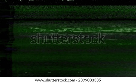 Glitch overlay. Noise texture. Analog distortion. Green color static old TV grain artifacts on dark black abstract free space illustration background.