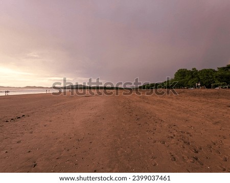 Sunset stormy clouds Costa Rica beach Tamarindo.