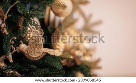 Christmas gold pine tree with background bokeh light, New Year sign for card.