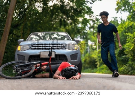 Young Asian man driving a car crashes into a cyclist falls and injures, Cyclist in need of urgent aid, Unexpected Roadside Encounter and Immediate Assistance for Outdoor Mishaps Car Crash. Royalty-Free Stock Photo #2399060171