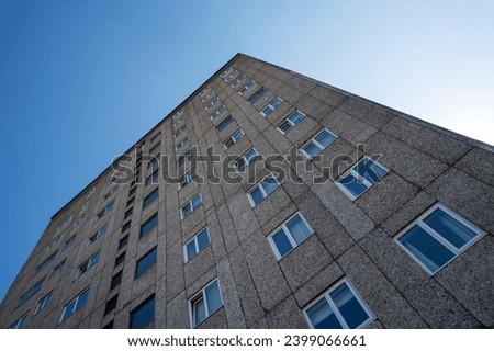 apartment building, brutalist architecture, pebbledash cladding. Royalty-Free Stock Photo #2399066661