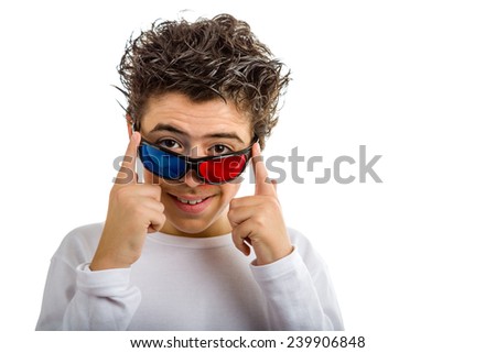 A cute Hispanic boy wears a pair of 3D Cinema eyeglasses with red and blue lenses and smiles