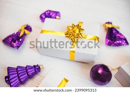 Christmas Decoration and gift box in Lavender Purple Violet color on white background.