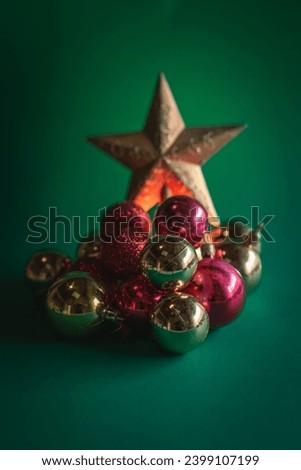 Christmas decoration with a Santa Claus, a Christmas star on a green background