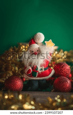 Christmas decoration with a Santa Claus, a Christmas star on a green background