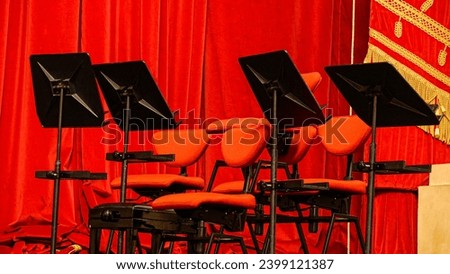 photo of theater behind the scenes and music stand at scala theater in milan