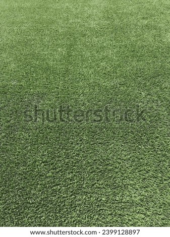Green artificial grass for fifa standard soccer field  Royalty-Free Stock Photo #2399128897