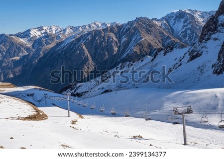 Ski resort with an open-type cable car overlooking the snow-covered valleys and the mountain cirque