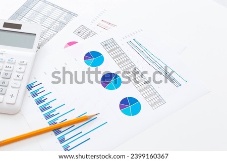 Calculator and scattered paper graphs.
Translation: year, tax rate, tax included, tax excluded, setting