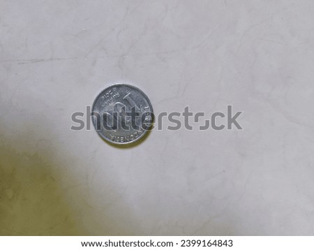 pile of indonesian rupiah coins finance concept photograph