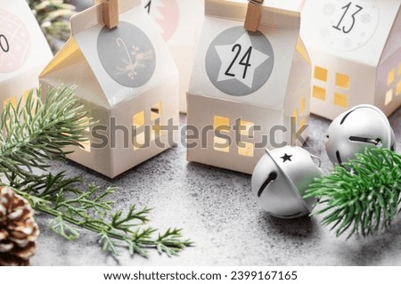 Preparation of christmas advent calendar. Advent calendar, Christmas gifts and decorations on a concrete background. 