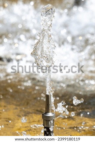 Splashes of water from a fountain as an abstract background.