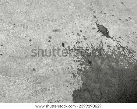 a dirty floor with stains.