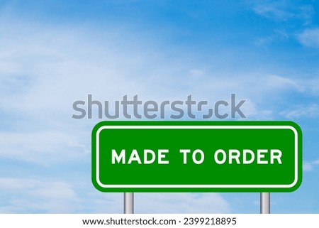 Green color transportation sign with word made to order on blue sky with white cloud background