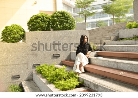 High-quality, free stock photo college students in campus environment, studying, enjoying simple moments, authenticity, a day in the life. Young Asean girl with book, curriculum 