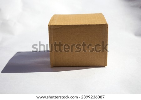 Brown cardboard box. A box closed on a table