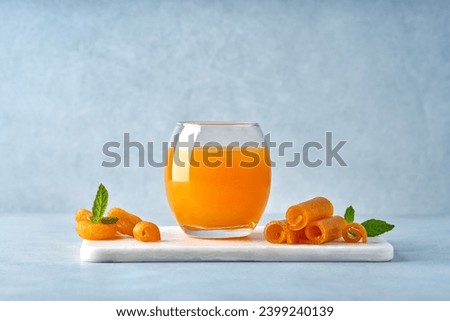  Middle Eastern apricot drink Qamar Al-Din. Rolled dried apricot paste and dried apricot . Traditional ramadan food                               Royalty-Free Stock Photo #2399240139