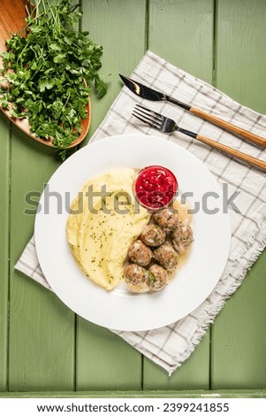 swedish meatballs with mashed potato Royalty-Free Stock Photo #2399241855