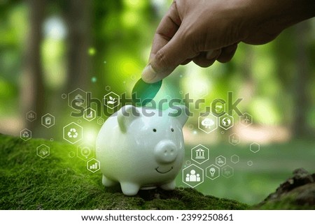 Sustainable Investment concept, Fundraising with environmental goal, Hand of human raise funds to support the environmental friendly Green Bonds project.
 Royalty-Free Stock Photo #2399250861