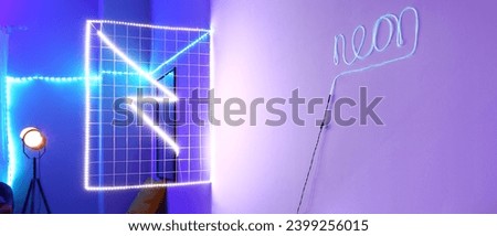 Stylish neon lighting in interior of modern room