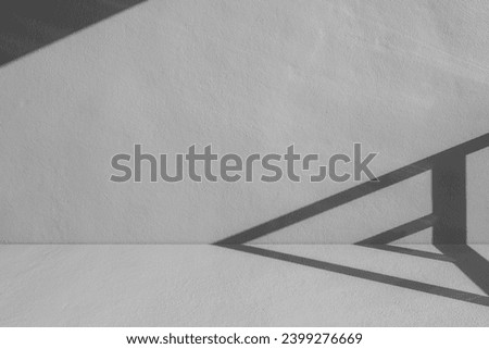 Grey concrete wall background and floor with shadow light well display product and text free space backdrop 