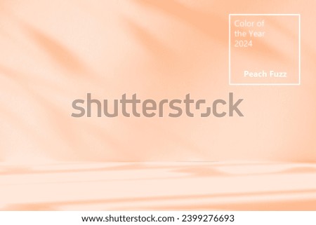 Trendy Color of the Year 2024 peach fuzz. Orange studio background for product presentation. Empty room with shadows of window and flowers and palm leaves . 3d room with copy space. Summer concert.  Royalty-Free Stock Photo #2399276693